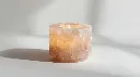 Ultra-photorealistic 8K studio product image of a hand-carved white Himalayan natural salt tealight candle holder glowing softly. Smooth cylindrical form, raw natural salt texture, clean white background, soft (2).webp